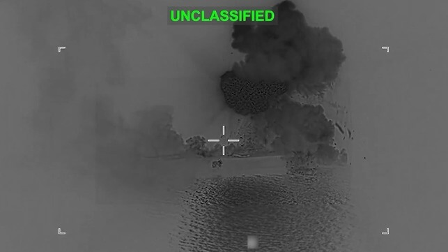 Debris cascades off the stern of IRIS Shahid Bagheri after a direct hit, March 5 (US Central Command)