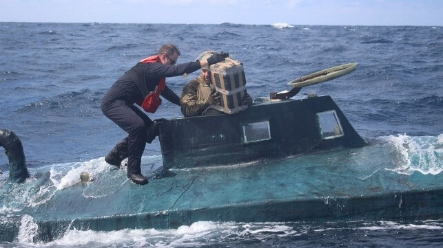 US Coast Guard boarding team retrieves cocaine from a semisubmersible in the Eastern Pacific (USCG)