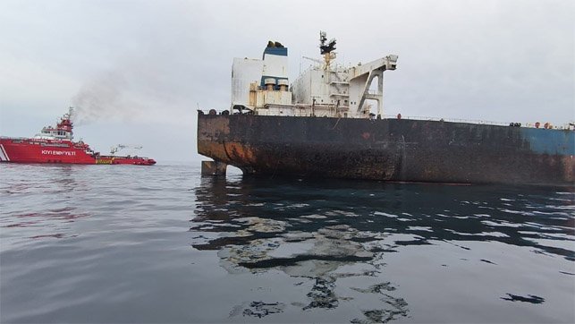 fire damaged tanker and rescue vessel